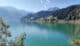 Ruhiger Wägitalersee mit Bergkulisse in der Schweiz. Symbolbild für MC Lago Connect und den Austausch von Kontakten und Ideen.